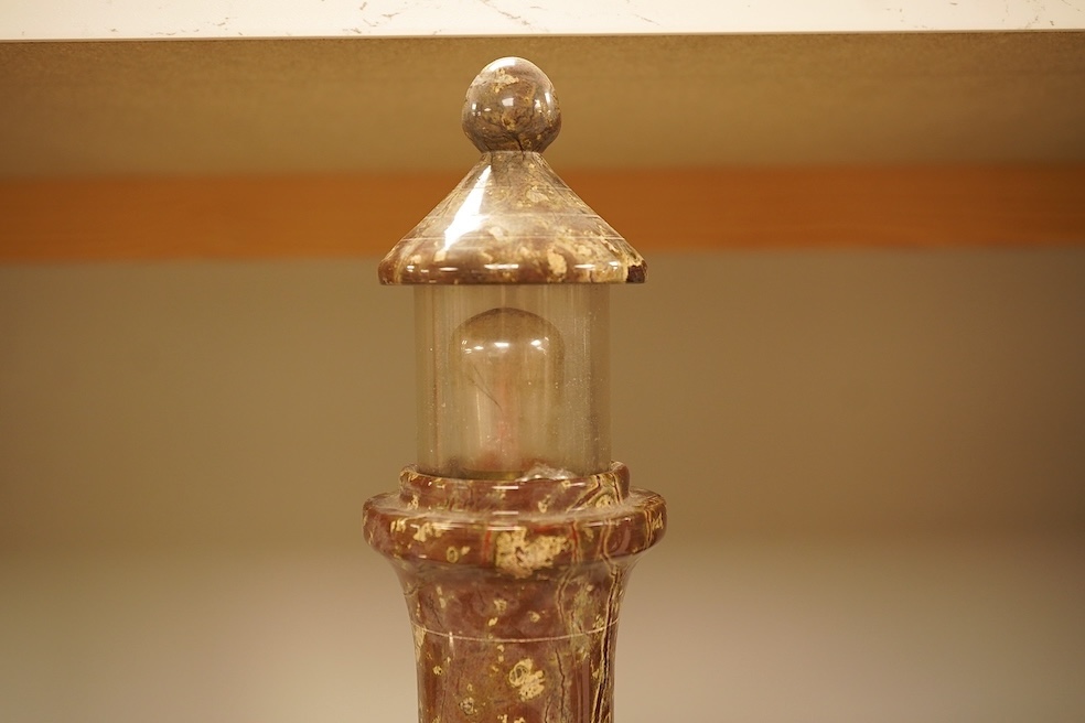 A serpentine lamp modelled as a lighthouse, 34cm high